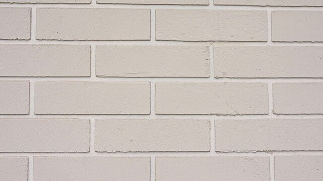 White brick wall texture background sliding downwards. Urban building material and construction abstract pattern video Full HD