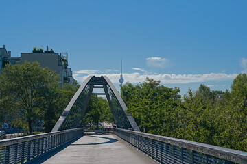 View on the Schwedter Steg bridge and Fernsehturm television tower above the trees of Mauerpark, Berlin, Germany  © Kristof Lauwers