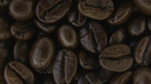 Macro Rotation of Roasted Coffee Beans Surface.
