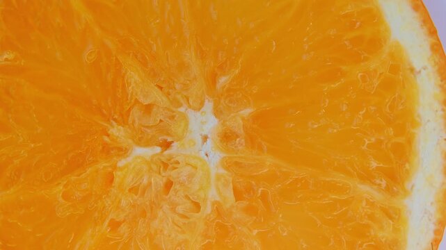 Fresh Orange Slice Rotation Macro Food Background.