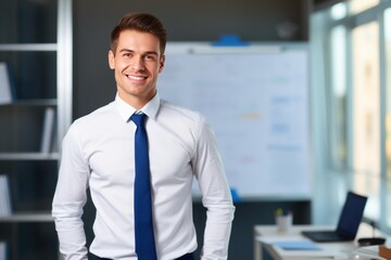 Fototapeta premium Young businessman standing in modern corporate office, symbolizing success and professional leadership