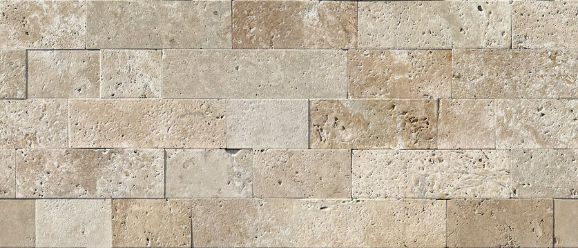 Seamless brickwork texture of natural beige travertine with characteristic pores and surface irregularities. Seamless stone cladding pattern in Mediterranean style for architectural visualization.
