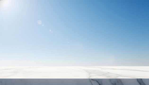 Empty white marble table top with a background of warm temperature and clear heaven under the sun for a bright summer weather product display concept
