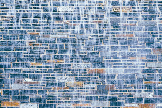 Age-old brick wall captured interacting naturally in an outdoor setting, in a clean visual environment, under daylight, with a natural mood, suitable for marketing, editorial.