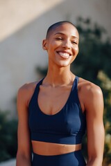 Fototapeta premium Woman smiling and standing outdoors in sunlit garden