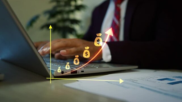 Business man using a laptop with hologram money bag graph bar arrow animation