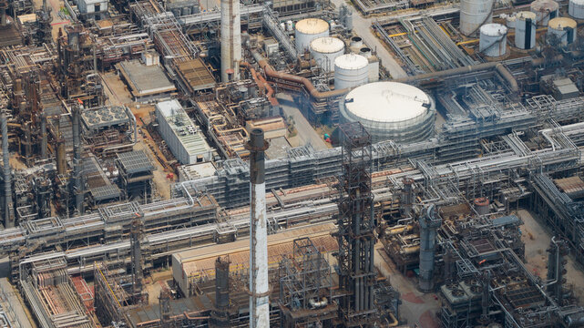 Aerial view of the Eastern Economic Corridor of Innovation EECi industrial complex with intricate piping and storage tanks Tambon Pa Yup Nai, Chang Wat Rayong, Thailand.
