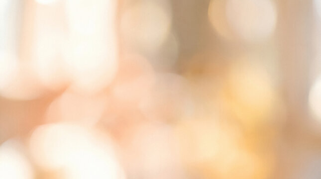 Abstract soft dreamy bokeh background with warm golden light and blurred sparkles.