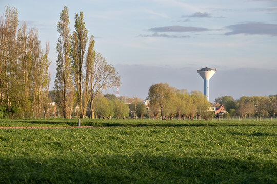 Wide rural landscape with water tower Ettelgem