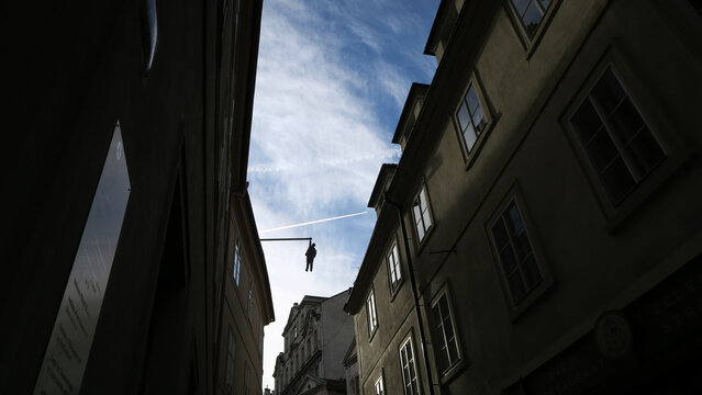 Prague, Czech Republic. Created in 1996, the work known as &ldquo;Zavě&scaron;en&yacute; muž&rdquo; (&ldquo;Man Hanging Out&rdquo;) is the vision of Czech sculptor David Čern&yacute;, whose work can be found all over the city