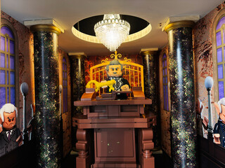 Naklejka premium Lego style judge in an ornate courtroom with chandelier and marble columns in London, UK, toy legal scene with gavel on judge bench