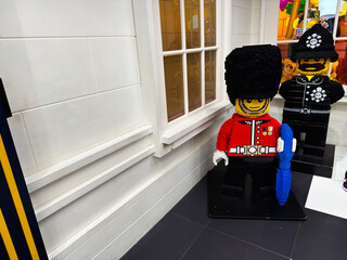 Naklejka premium Lego guard and policeman brick sculptures in a London UK toy store window display