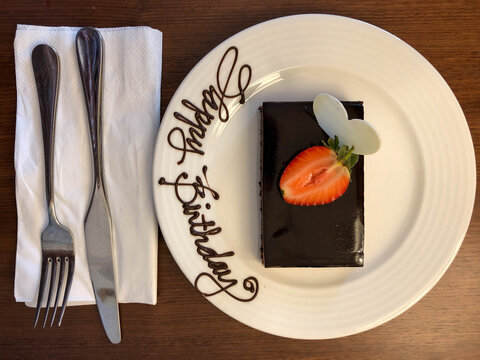 Happy Birthday chocolate cake with strawberry