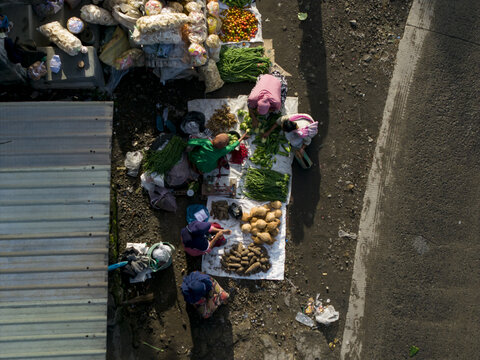 Aerial view of vendors selling fresh vegetables and local produce at Pasar Kembang Klaten traditional market Klaten, Central Java, Indonesia.