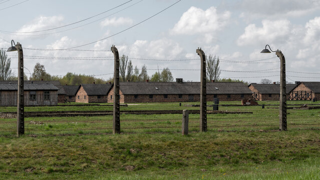 Close-up of a brick chimney structure at Auschwitz II-Birkenau. Detailed view of historical masonry within the prisoner barracks at the Holocaust. Oswiecim, Poland - April 21, 2026.
