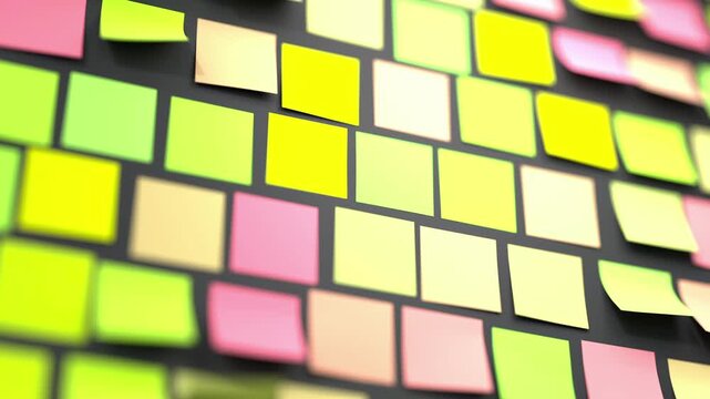 Blank sticky notes in yellow, green, pink, and cream tones arranged in a diagonal grid on a dark surface. Papers flutter gently with shallow depth of field creating bokeh blur at edges. Ideal for