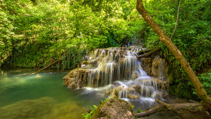 Obraz premium Cascade waterfalls. Krushuna falls in Bulgaria near the village of Krushuna, Letnitsa.