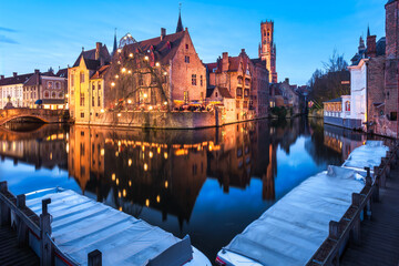 Obraz premium Rozenhoedkaai Canal at Blue Hour with Christmas Lights and Belfry Tower Reflection, Bruges, Flanders, Belgium