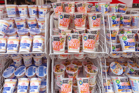 Osaka, Japan - April 25, 2026: Cup Noodles raman food packages sold outside of a shop on Dontonbori street