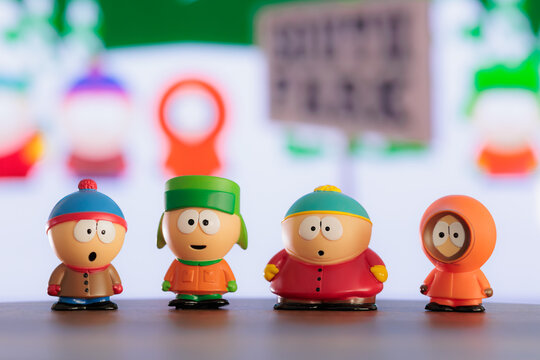 ISTANBUL, Turkiye - MAY 9 2026: South park cartoon characters: Kenny, Eric, Stan, Kyle as toy figures on the background of the TV screen