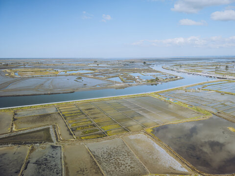 Aerial view of colorful Aveiro Salt Marshes and Aveiro Lagoon, Gloria, Aveiro, Portugal.
