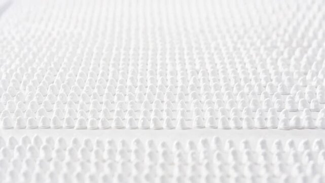Soft white textured fabric with gentle movement, clean and serene background