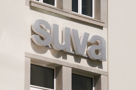 SUVA insurance sign hanging on a building in St. Gallen