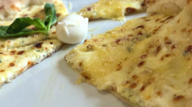 family sharing cheese pizza pulling slices melted cheese close up dining scene 