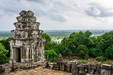 Fototapeta premium Phnom Bakheng temple tower overlooking the Angkor countryside.