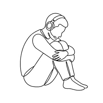 Sad Young Man Wearing Headphones Sitting.