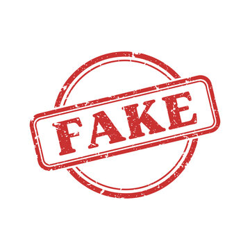 A red rubber stamp with the word FAKE imprinted on a white background.