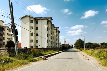 Modern Residential Apartment Block along a Paved Road in Syokimau Suburb, Kenya © martin