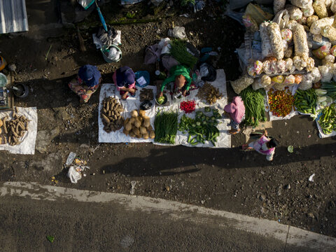 Aerial view of Pasar Kembang Klaten traditional market with vendors selling fresh vegetables and local snacks on the ground Klaten, Central Java, Indonesia.