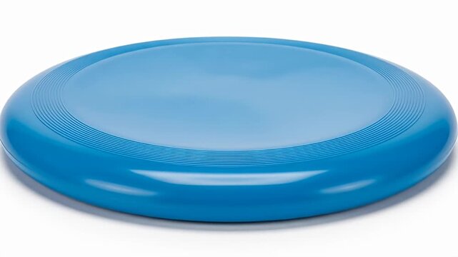 Bright blue plastic flying disc with ribbed edge laying on a white surface