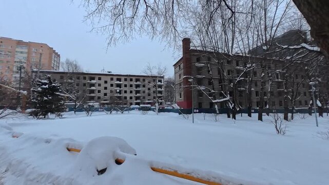 Abandoned apartment buildings in snowy urban winter landscape desolate architecture urban decay demolition