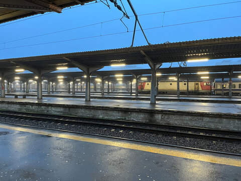 Train station platforms with trains parked at dawn in Bucharest
