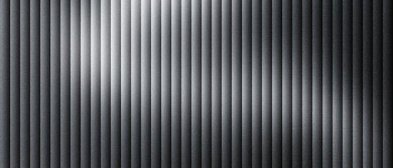 Obraz premium Industrial corrugated metal texture with vertical ridges, dark gray brushed steel surface with soft light reflections, metallic ribbed wall paneling, modern architectural aluminum backdrop.