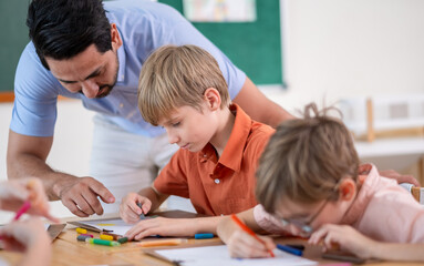 Fototapeta premium Teacher Helping Elementary Students with Drawing Activity in Classroom. Creative Classroom Lesson with Kids Coloring and Drawing, Education and Child Development in Modern Setting with boy, girl.