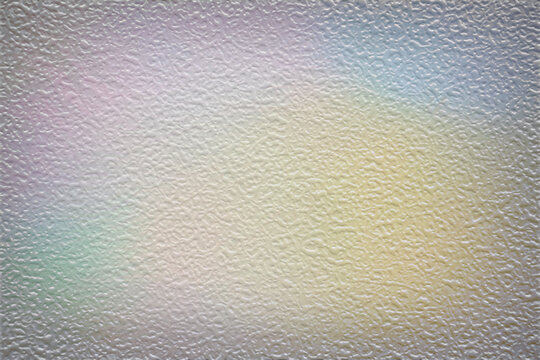frostered textured wall background with soft pastel rainbow light abstract background