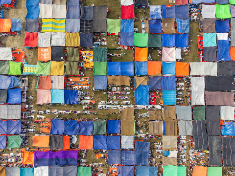 Tongi, Bangladesh - 31 January 2025: Aerial view of thousands of pilgrims gathered under colorful makeshift tents during the Bishwa Ijtema religious congregation.
