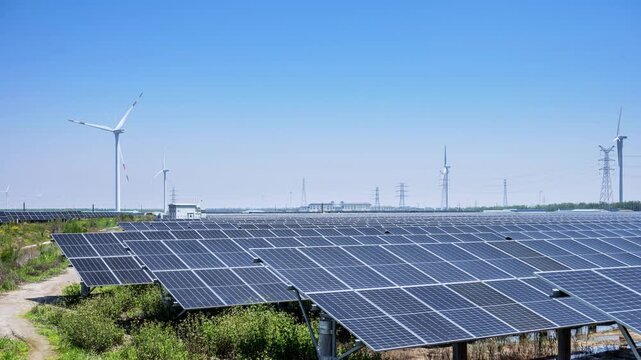 Time-lapse of Large-Scale Solar and Wind Hybrid Renewable Energy Farm Under Clear Blue Sky