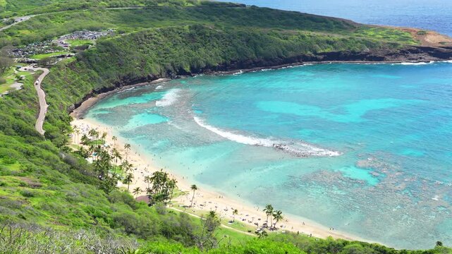 Hawai'i - Bright vibrant ocean view of Hanauma Bay on Oahu, Hawaiʻi, showcasing clear blue tropical waters, lush green coastline, and scenic island beauty on a sunny day.