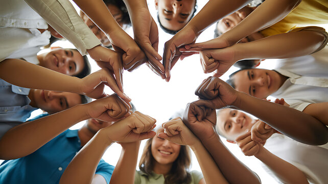 Group of people joining hands in circle emphasizing speed, motion, and dynamic energy
