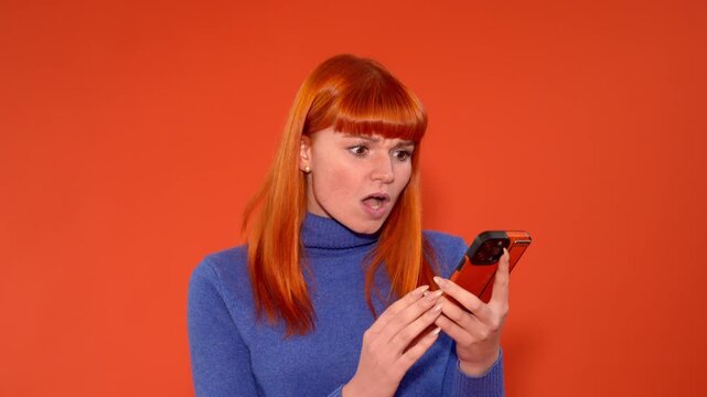 Person expresses different emotions while using smartphone in orange background