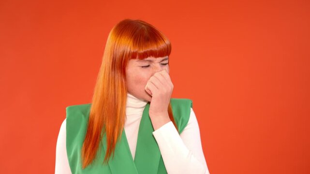 Woman sneezing in a colorful setting while expressing varied emotions with her facial expressions