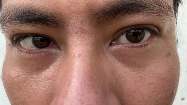 Close up of man eyes looking around and at camera