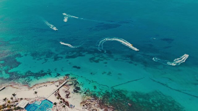 Aerial Drone Flight Over wave runners on  Turquoise Ocean Waves in Cancun Caribbean Sea Mexico