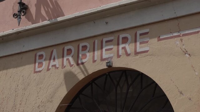 Barbiere prominently displayed on a building facade Italian for barbershop