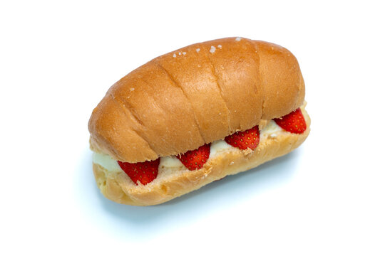 Shio Pan, Salted baked bread with soft cream and strawberry on isolated white background. Top view.