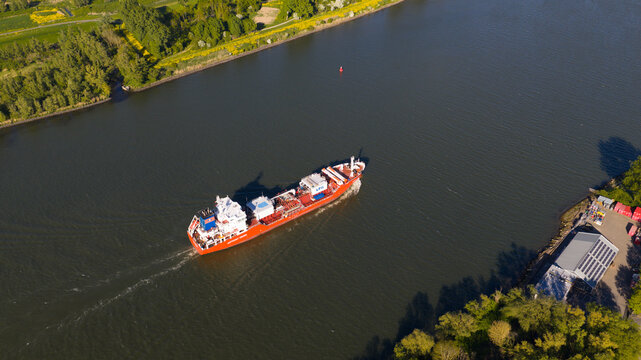 Dordrecht, Netherlands - 29 April 2026: Drone view of Coral Pearl with folded WAPS units, showing eSAIL and wingsail technology for fuel saving and more sustainable maritime transport.